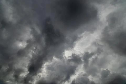 Grey incoming storm clouds full frame background Stock Photos