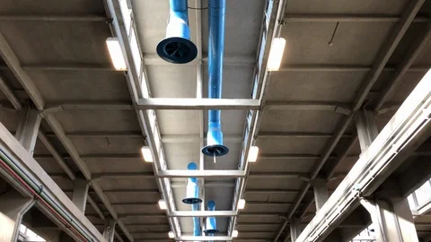 A grey industrial ceiling with blue tubes. Stock-Footage 86131043