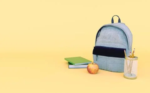 Grey jeans backpack in yellow background with books, apple and pencil Back to Illustrazione stock