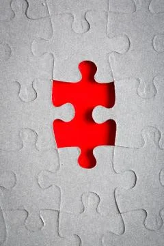 Grey jigsaw puzzle texture with missing pieces Stock Photos