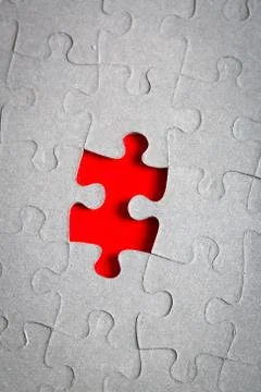 Grey jigsaw puzzle texture with missing pieces Stock Photos
