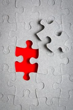 Grey jigsaw puzzle texture with missing pieces Stock Photos