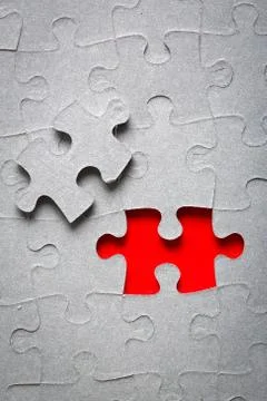 Grey jigsaw puzzle texture with missing pieces Stock Photos