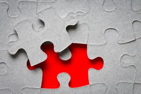 Grey jigsaw puzzle texture with missing pieces Stock Photos