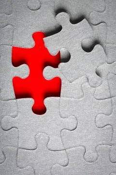 Grey jigsaw puzzle texture with missing pieces Stock Photos