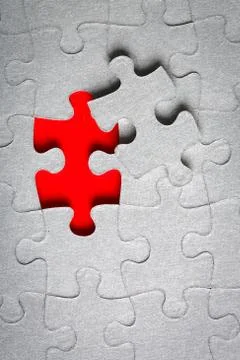 Grey jigsaw puzzle texture with missing pieces Stock Photos