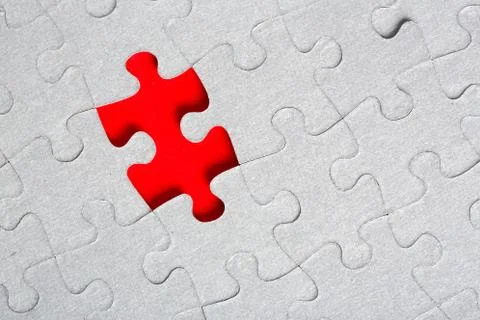 Grey jigsaw puzzle texture with missing pieces Stock Photos