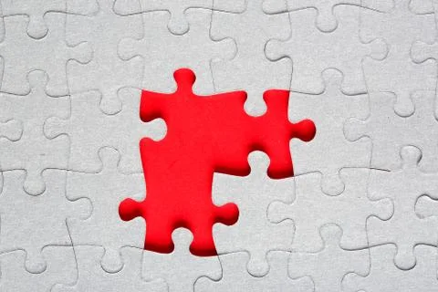 Grey jigsaw puzzle texture with missing pieces Stock Photos
