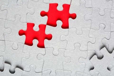 Grey jigsaw puzzle texture with missing pieces Stock Photos