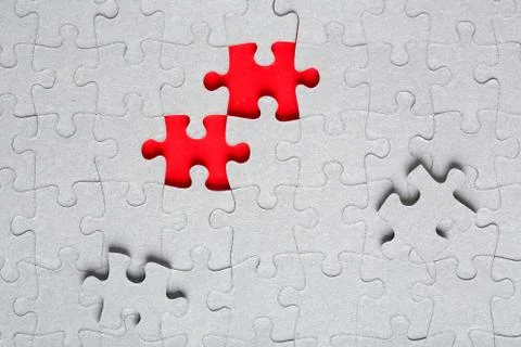 Grey jigsaw puzzle texture with missing pieces Stock Photos