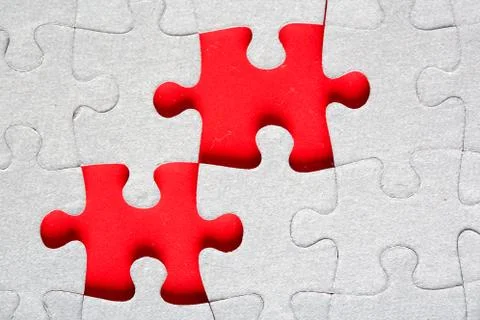 Grey jigsaw puzzle texture with missing pieces Stock Photos