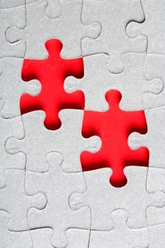 Grey jigsaw puzzle texture with missing pieces Stock Photos