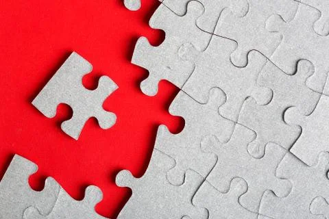 Grey jigsaw puzzle texture with missing pieces Stock Photos