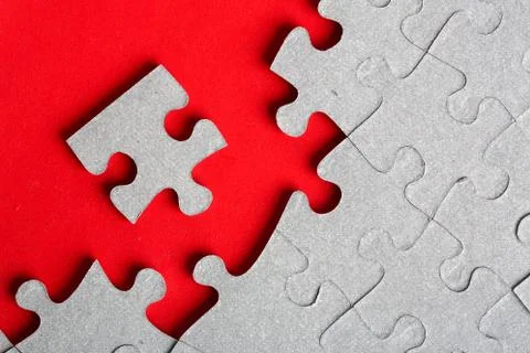 Grey jigsaw puzzle texture with missing pieces Stock Photos