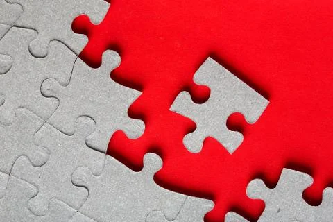 Grey jigsaw puzzle texture with missing pieces Stock Photos