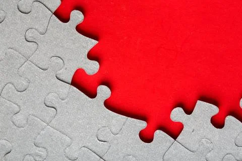 Grey jigsaw puzzle texture with missing pieces Stock Photos