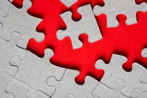 Grey jigsaw puzzle texture with missing pieces Stock Photos