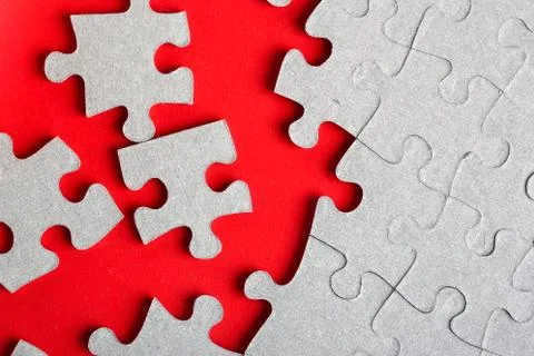 Grey jigsaw puzzle texture with missing pieces Stock Photos