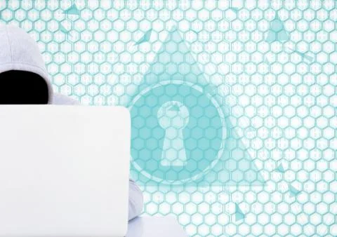 Grey jumper hacker with out face with the computer in the desk. lock Stock Illustration