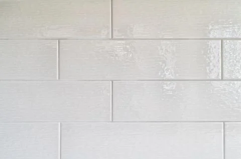 Grey kitchen backsplash made with rectangular ceramic tiles Stock Photos