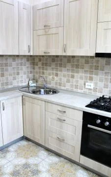 Grey kitchen cabinets. Interior design. Stock Photos