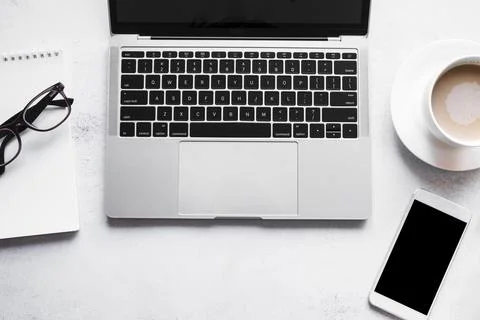 Grey laptop with office elements Stock Photos