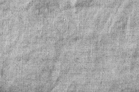 Grey linen canvas. The background image, texture. Stock Photos