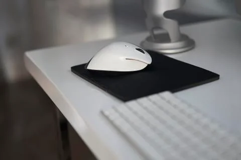 Grey microphone in a white table Stock Photos