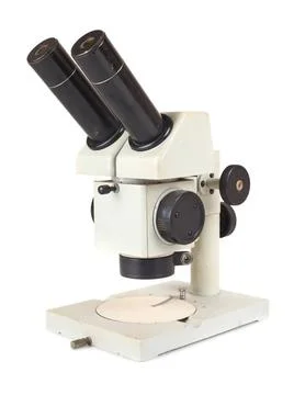 Grey microscope Vintage binocular grey microscope isolated on white backgr... Stock Photos