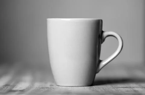 Grey mug on the desktop Stock Photos