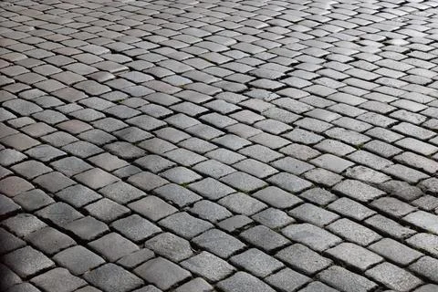 Grey pattern of cobblestones gives a harmonic background Fotos Stock