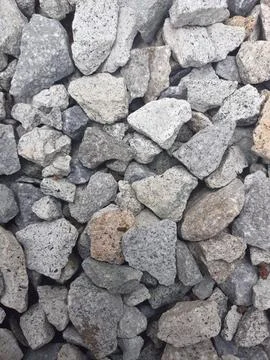 Grey pebbles background in vertical angle Foto stock