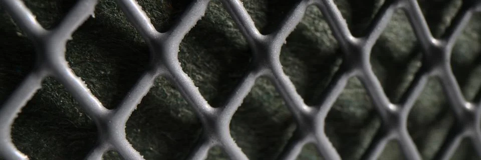 Grey perforated metal mesh as abstract industrial background Stock Photos