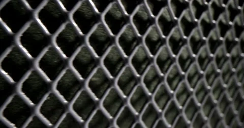 Grey perforated metallic mesh with dark square grid pattern Stock Footage 238519688