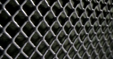 Grey perforated metallic mesh with dark square grid pattern Stock Footage 278990810
