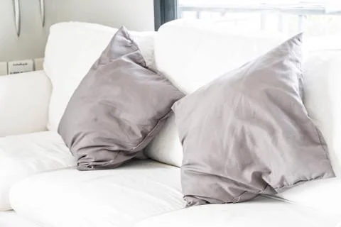 Grey pillow on sofa Stock Photos