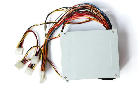 Grey power supply for the computer with cables unit for pc on white backgroun Photos
