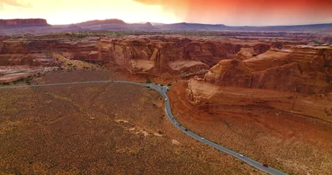 Grey road going across the plain near beautiful rocks of Zion Canyon.  Stock Footage 212137438