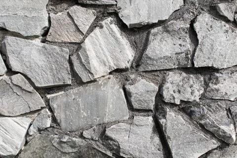 Grey rock wall old Stock Photos