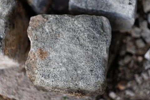 Grey rough cobblestone texture background on pavement Stock Photos