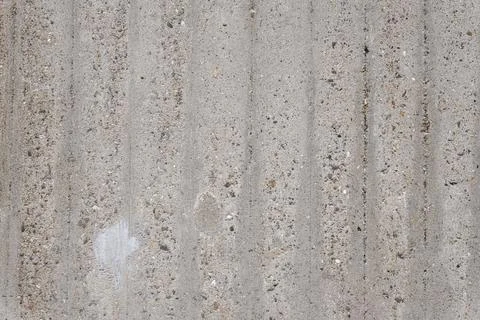 Grey rough concrete wall texture background with vertical grooves Stock Photos
