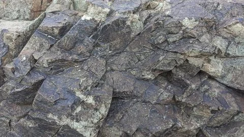 A Grey Rough Surface of the Boulder, Stone or Rock, beautiful Texture Stock Photos