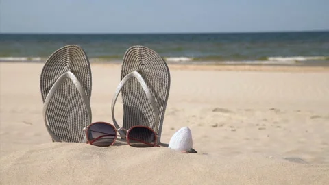 Grey sandals at the beach on a Stock Video Pond5