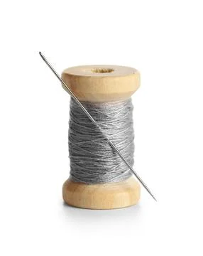 Grey sewing thread with needle on white background Stock Photos