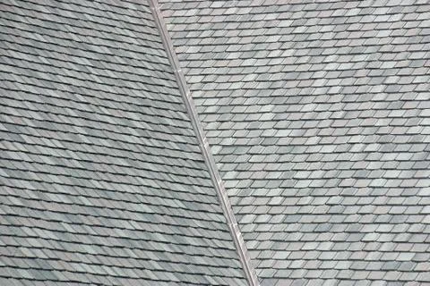 The grey shingles on a large rooftop Stock Photos