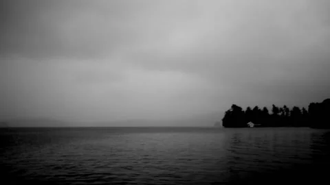 Grey sky greets the day over the lake 스톡 동영상 166587458
