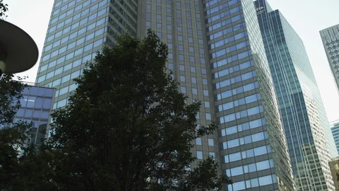 Grey Skyscraper reflection with blue glass windows at business district in Video stock 119362266