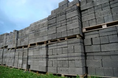 Grey slag stones in stacks at construction supermarket Stock Photos