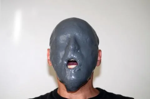 Grey slimed face Stock Photos