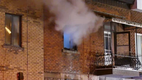 Grey smoke and firemen climbing ladder Stock Footage 101993167
